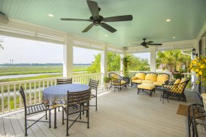 covered porch with table, chairs and couch