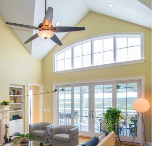 arched windows above double French doors