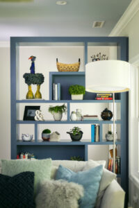 Interior design makes this blue bookshelf stand out